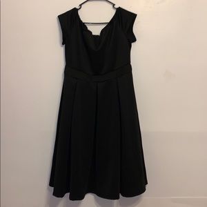 A black v neck cut dress